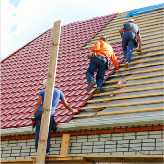 men fixing red roof